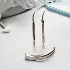What is the purpose of a retractor?